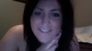 A red dildo for a bored round brunette on camera
